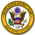 Badge for United States District Court Middle District of Florida - Round circle with a black outer line and an inner yellow ring with black inner line and black letters in between all capped on the top arch “• UNITED STATES DISTRICT COURT •” and black letters all capped on the bottom arch “MIDDLE DISTRICT OF FLORIDA”, and inside that ring is a picture of a bald eagle with his wings spread open and a ball on the top of his head which is ringed on the outside with red stripes and on the inside is blue with white 13 stars, to the left and right sides of the ball is a gold fluttering ribbon, and on the eagle’s chest is a shield with a blue top and 13 red and white stripes and the eagles grasps an olive branch in its right talon and a bundle of 13 arrows in its left talon