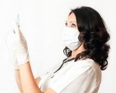 Picture of nurse with mask gloves and needle