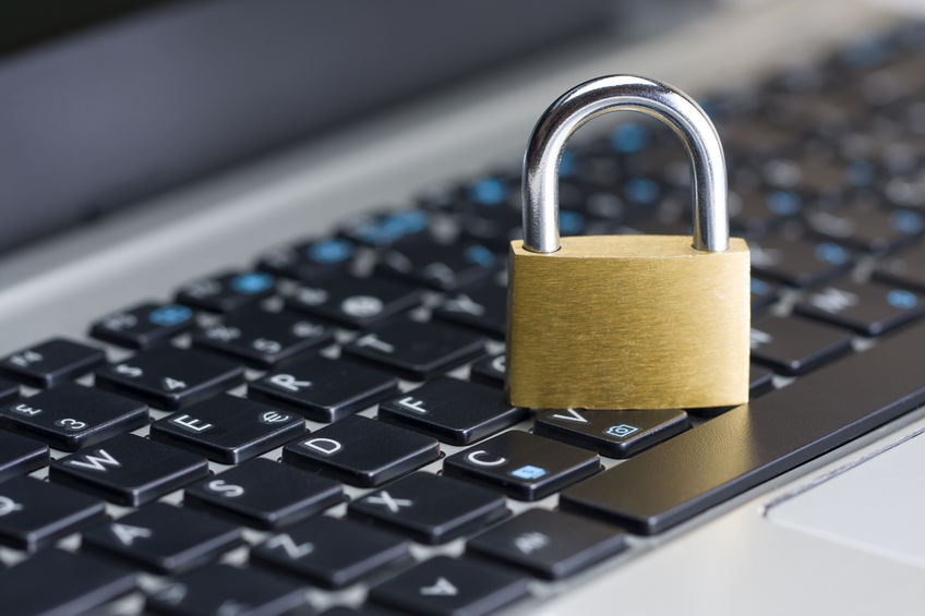 Picture of black keyboard with golden padlock sitting on top