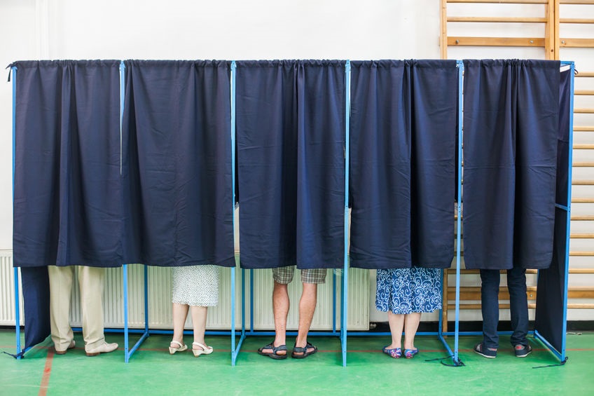 Picture of 5 curtained voting booths