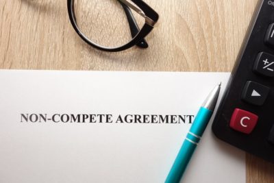 Sass Law Firm Blog non-compete form on a desk