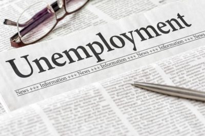 SLF Blog Unemployment Extension with picture of newspaper with a headline of unemployment