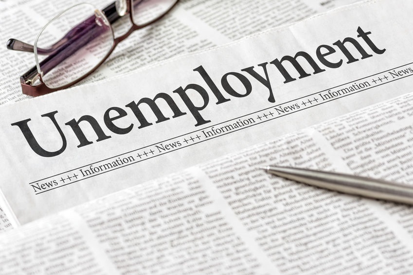 Picture of Unemployment newspaper with pen and a pair of wire-rimmed glasses