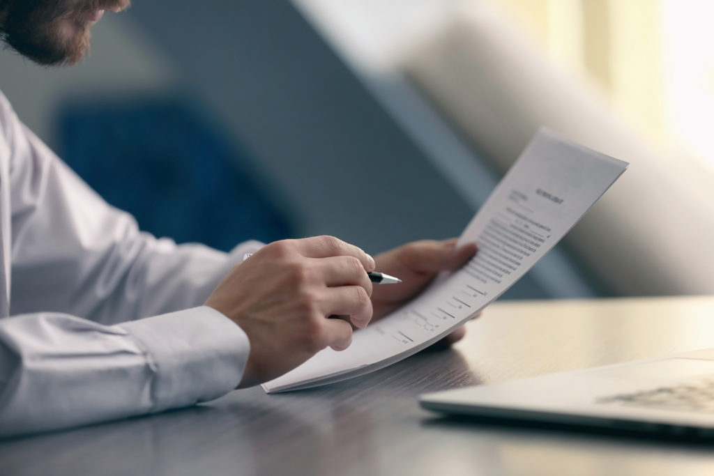 Businessman reading employment contracts