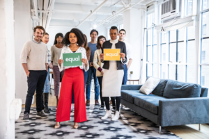 Picture of a diverse group of employees standing for equal rights in the workplace