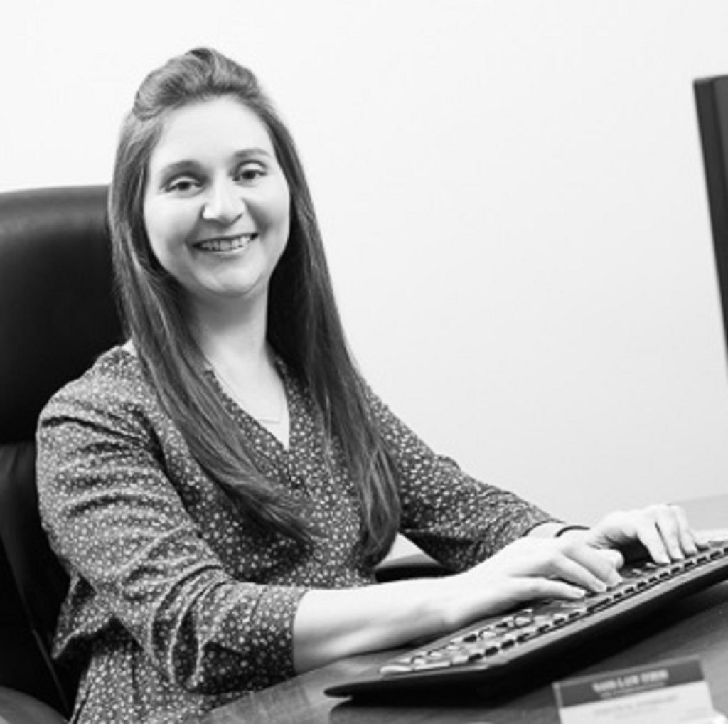 Picture of Yvette Everhart Board Certified Employment Lawyer sitting at her desk with a keyboard