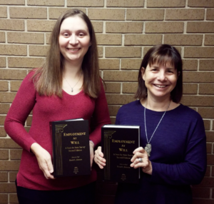 Picture of employee rights attorneys Yvette Everhart and Cynthia Sass holding the 2017 2nd Edition of Employment at Will, a State-by-State survey 