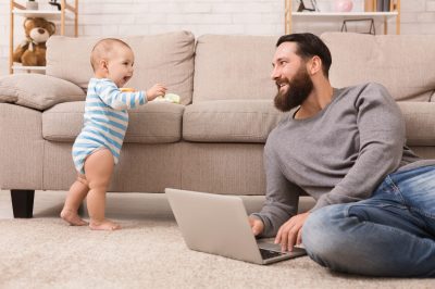 Picture of father with small child at home FMLA